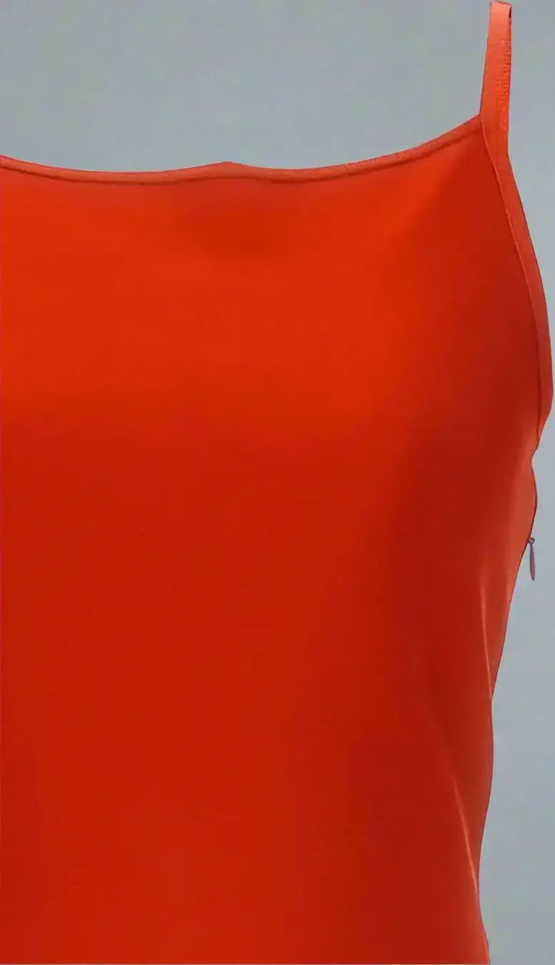 Close-up of vibrant orange camisole with thin straps and side zipper for Alexander McQueen dress