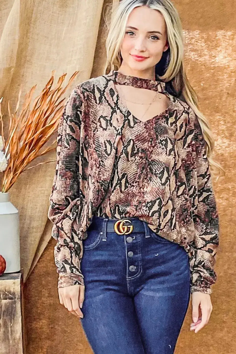 Women’s snake print blouse with choker neck and dolman sleeves from And The Why