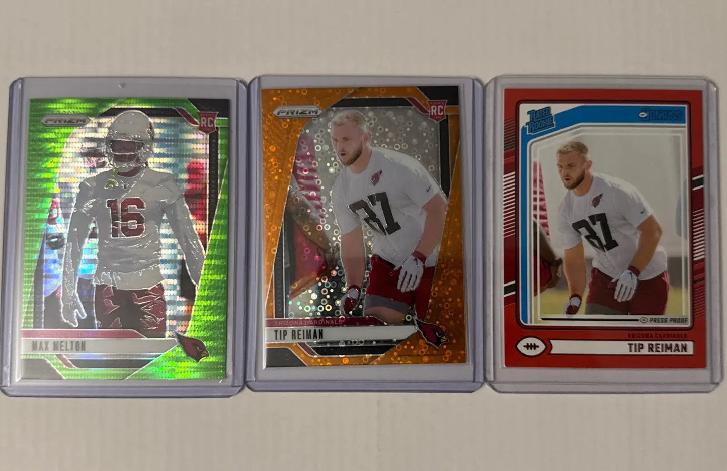 Arizona Cardinals RC Lot featuring three football trading cards in protective sleeves