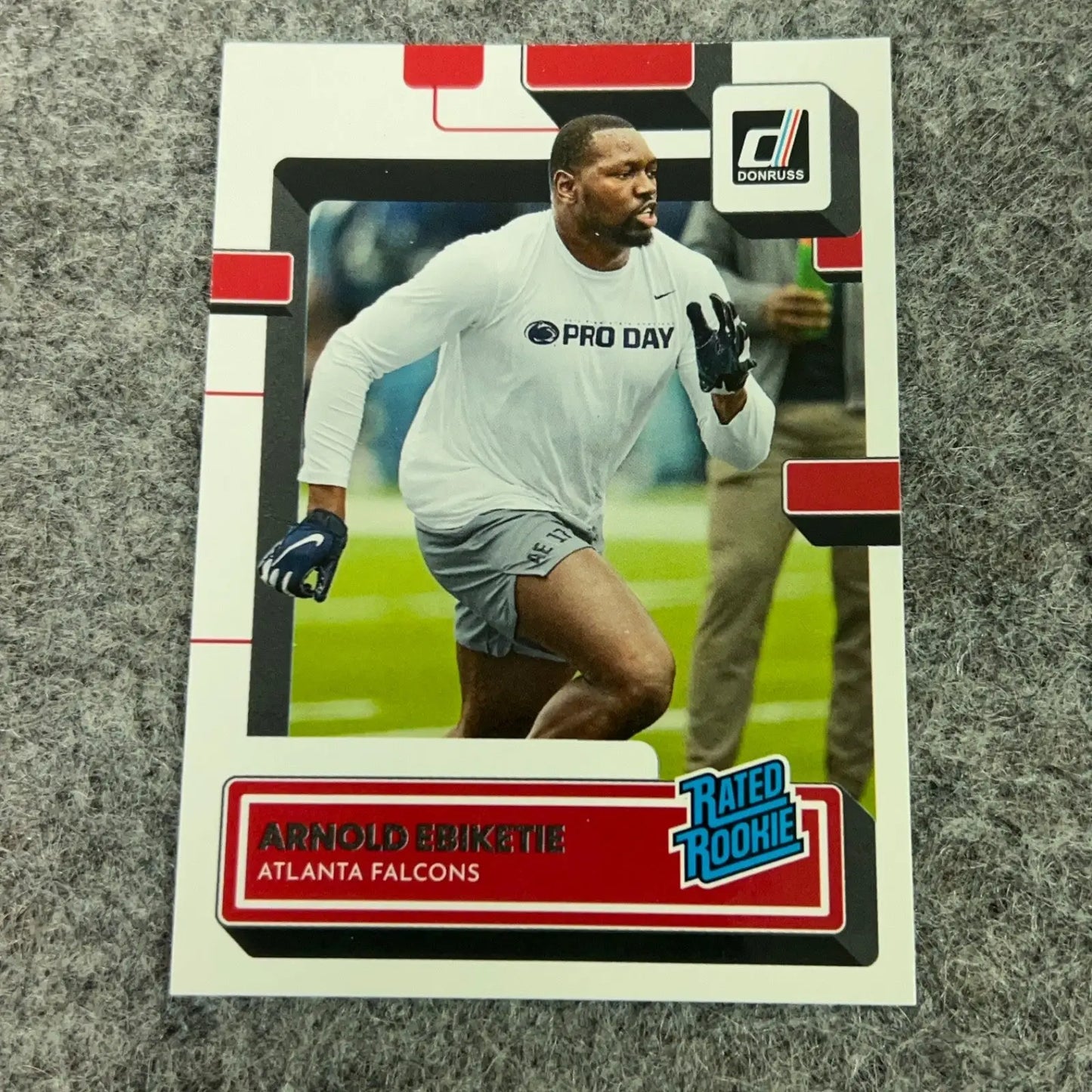 Donruss Arnold Ebiketie Rookie Atlanta Falcons football trading card featuring Rated Rookie image