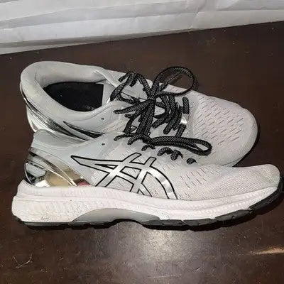 White and silver Asics running shoes with black laces for women size 9.5