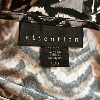 Black and white patterned long sleeve blouse with Attention brand tag