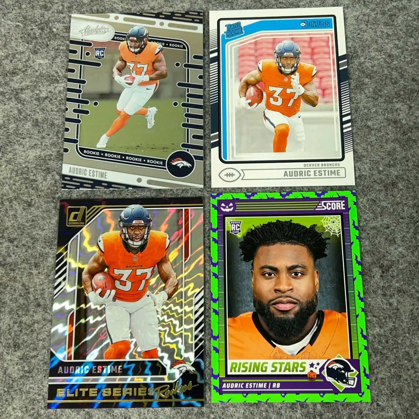 Four Audric Estime rookie football cards from the Estime Rookie Denver Broncos 2024 Panini set