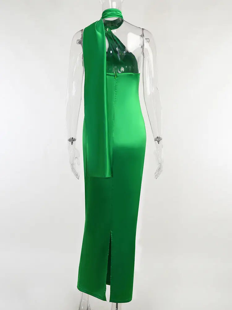 Emerald green satin backless maxi dress with halter neck and side slit for elegant occasions