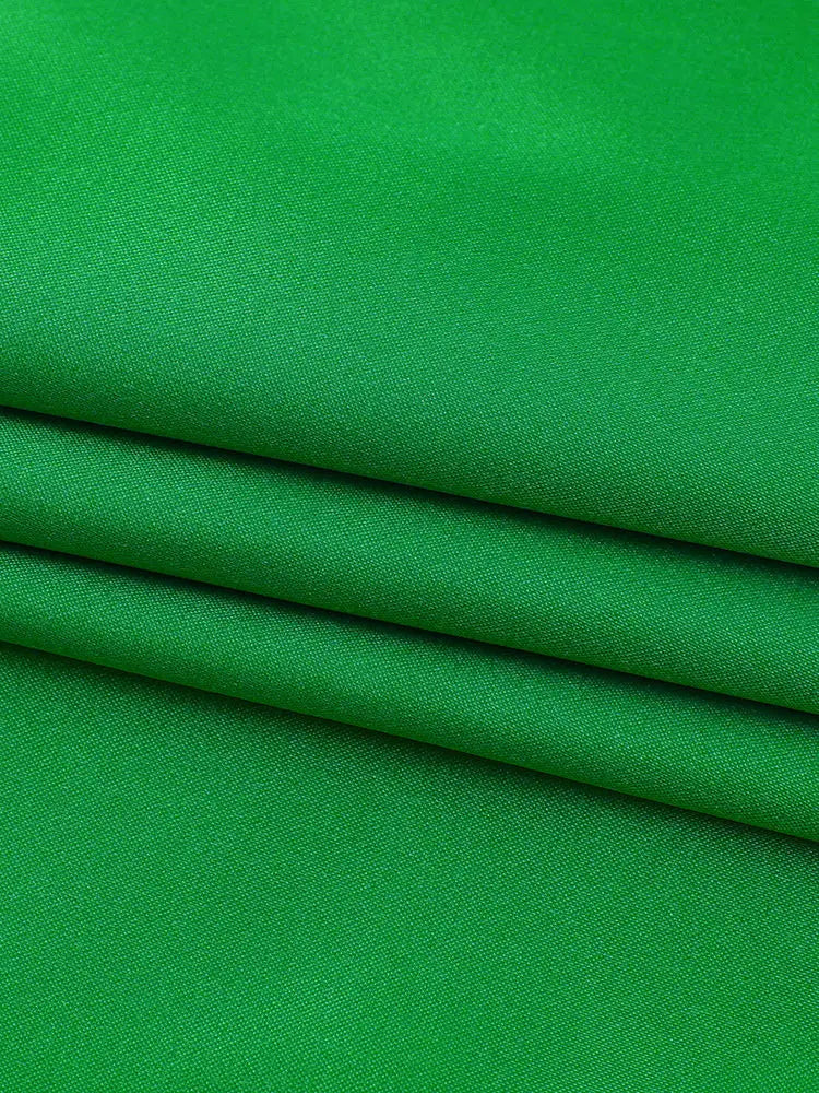 Vibrant green backless maxi dress with subtle diagonal weave perfect for elegant occasions