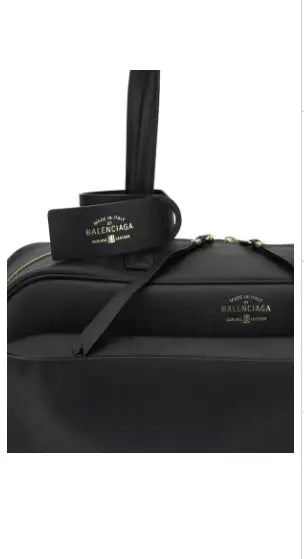 Black leather Balenciaga Carrie Medium Bowling Shoulder Bag with top handles and shoulder strap
