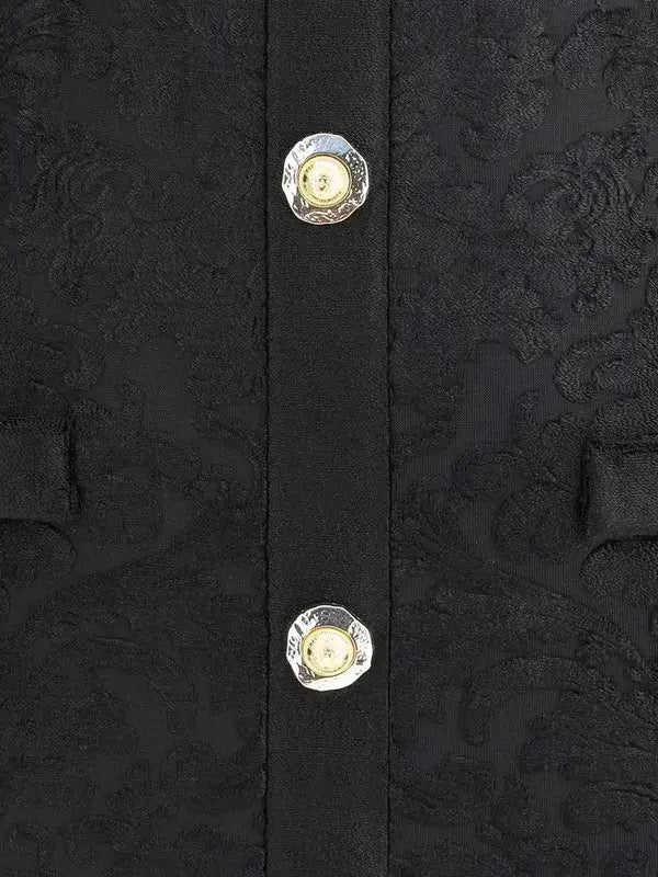 Black fabric with ornate buttons on BALMAIN baroque short dress showcasing elegant design