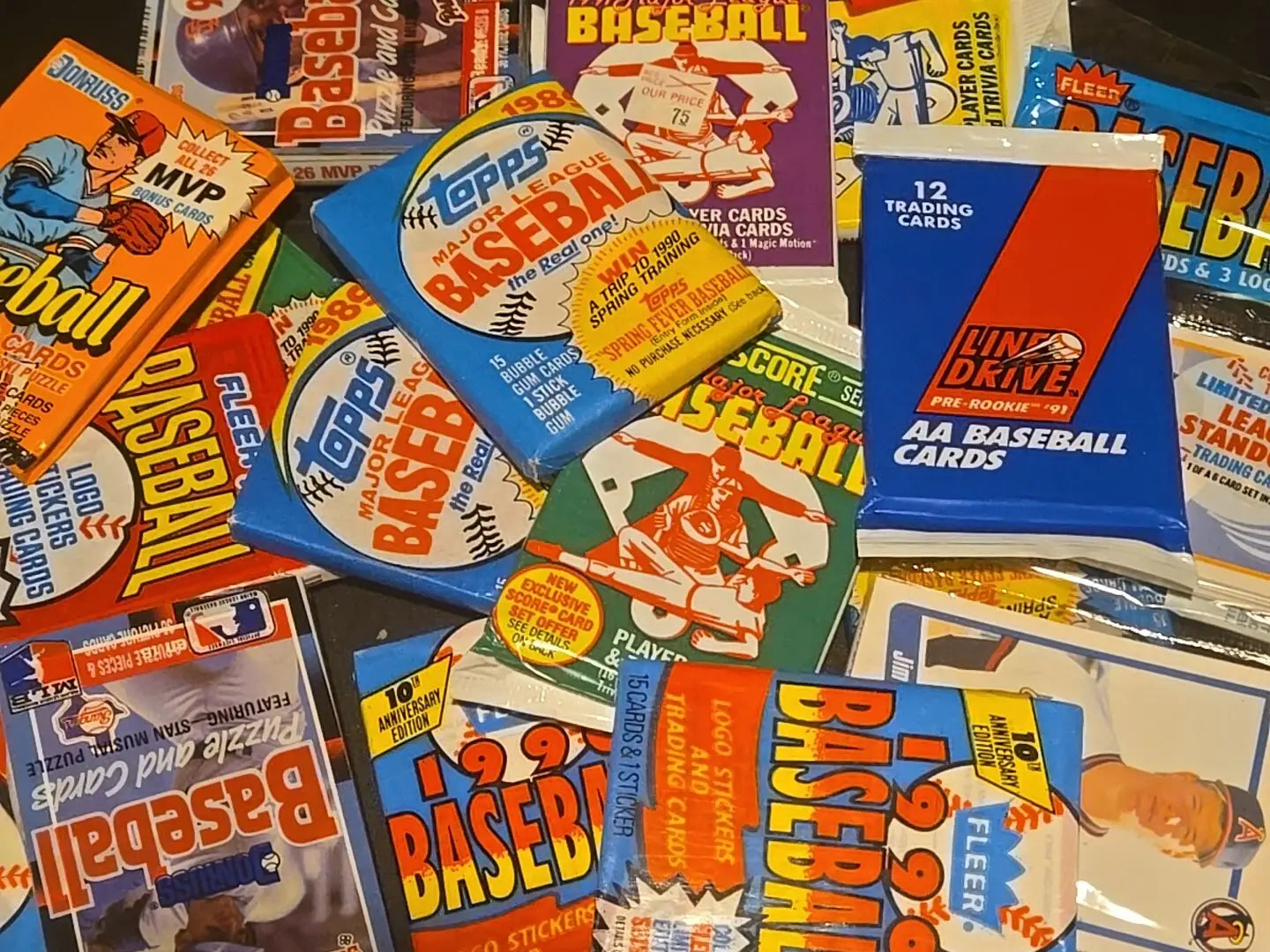 Vintage baseball card packs featuring trading cards in a lot of 5 packs