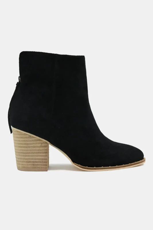 Black suede point toe ankle booties with wooden heel and zipper detail