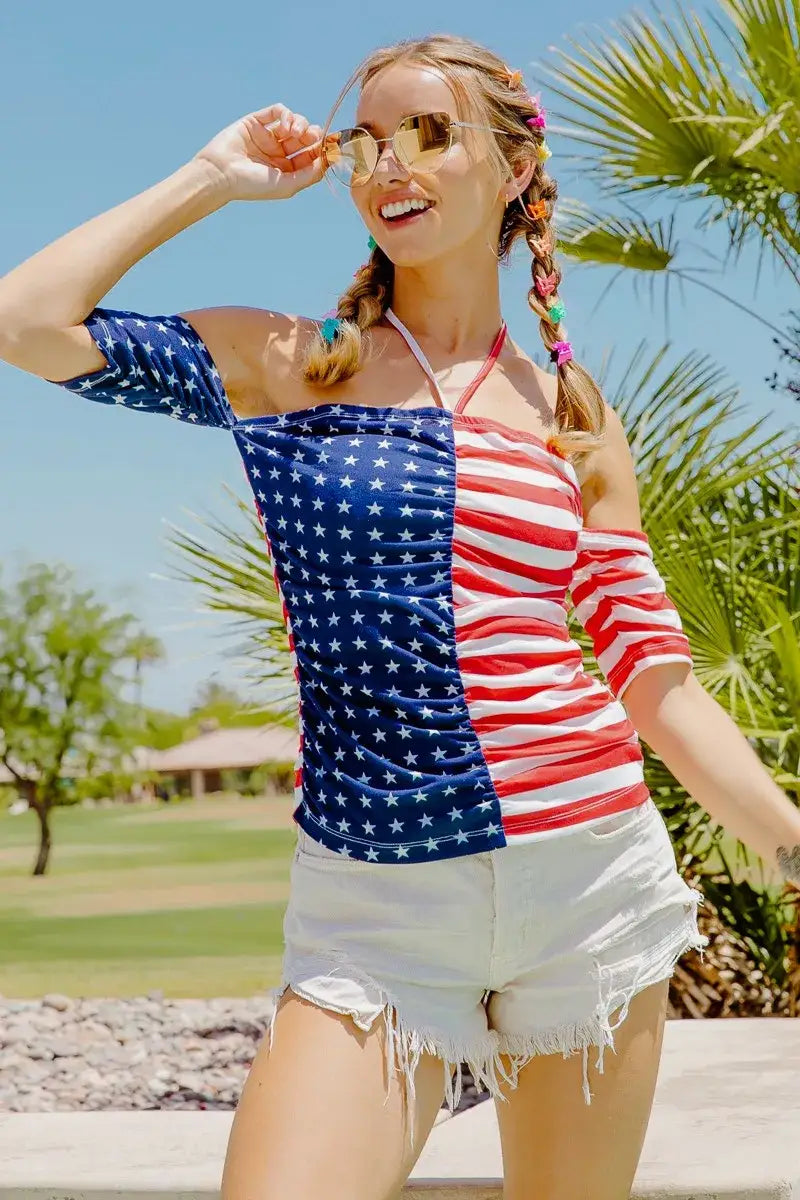 Patriotic American Flag off-the-shoulder top with ruched detailing and white denim shorts