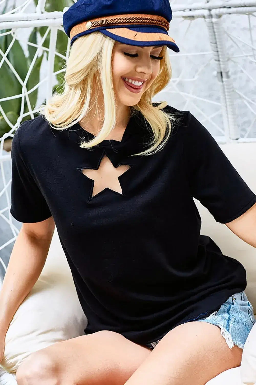 Black star cutout short sleeve T-shirt with navy blue cap and denim shorts for stylish casual wear