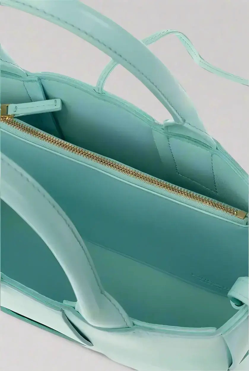 Light teal leather tote bag with gold-tone zipper from BOTTEGA VENETA Arco Mini Tote collection