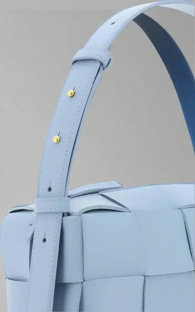 Light blue woven leather Bottega Veneta Small Brick Cassette Bag with gold-studded adjustable strap