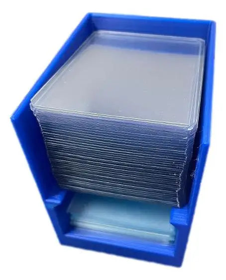Break Buddy blue storage box filled with stacks of clear penny sleeves for card protection