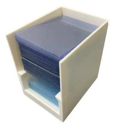 Break Buddy white toploader and penny sleeve holder with stacked clear plastic penny sleeves