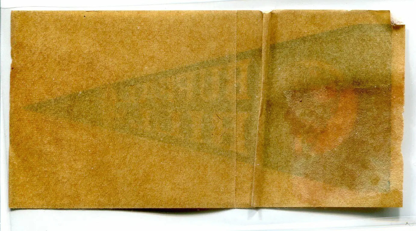 Worn, folded, and stained paper packet for Buffalo Bills 1964 pennant sticker decal