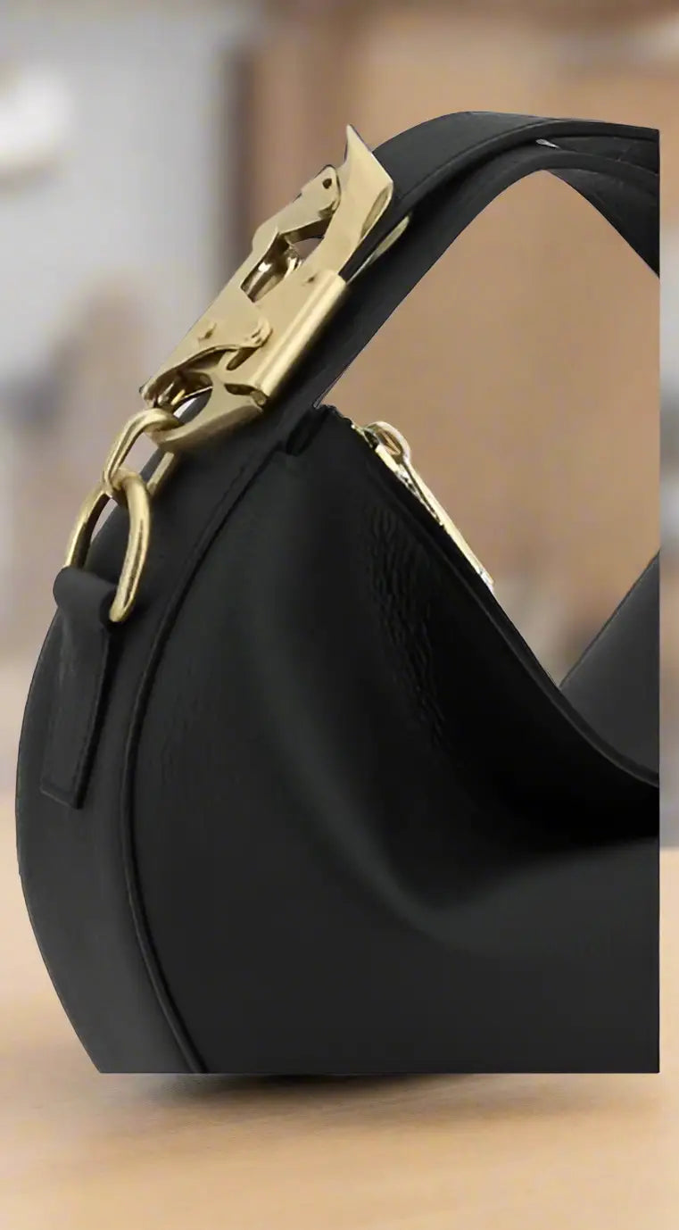 Black leather Burberry women’s hobo bag with gold-tone metal clasp