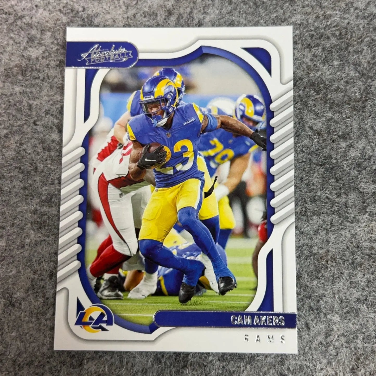 Sports trading card of Cam Akers in blue and yellow Los Angeles Rams uniform