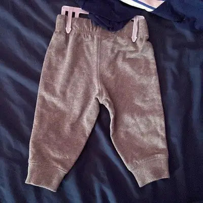 Gray infant sweatpants with ribbed cuffs and elastic waistband from Carter’s 2-Piece Baby Outfit Set