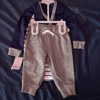 Newborn baby boy wearing Carter’s gray blue 2-piece outfit with hooded jacket and sweatpants