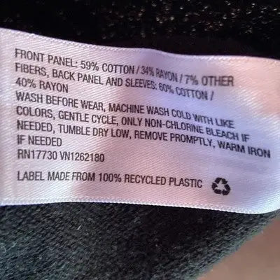 Clothing care label on Jack Girls Black Silver Knit Dress size 6/6X for girls