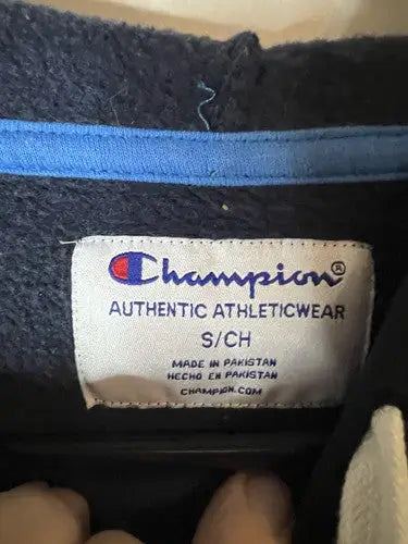 Champion color block hoodie clothing tag with authentic athleticwear label and size S/CH