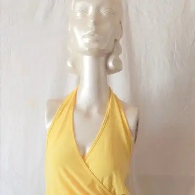 Yellow halter top on mannequin in Charming Women’s Yellow Halter Sundress Size Small