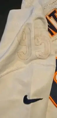 White Chicago Bears sports jersey with number, logo, and worn, torn details