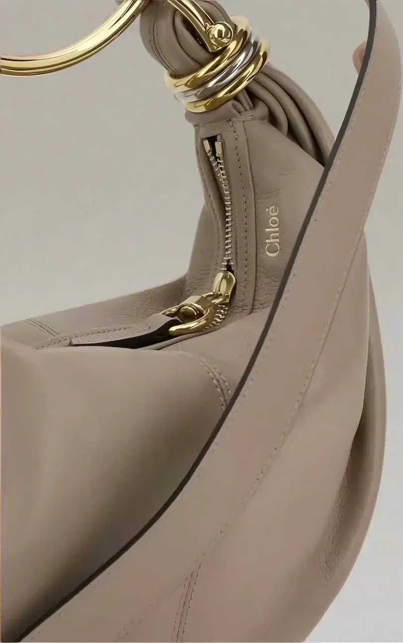 Light taupe leather chloé bracelet handbag with gold and silver ring hardware