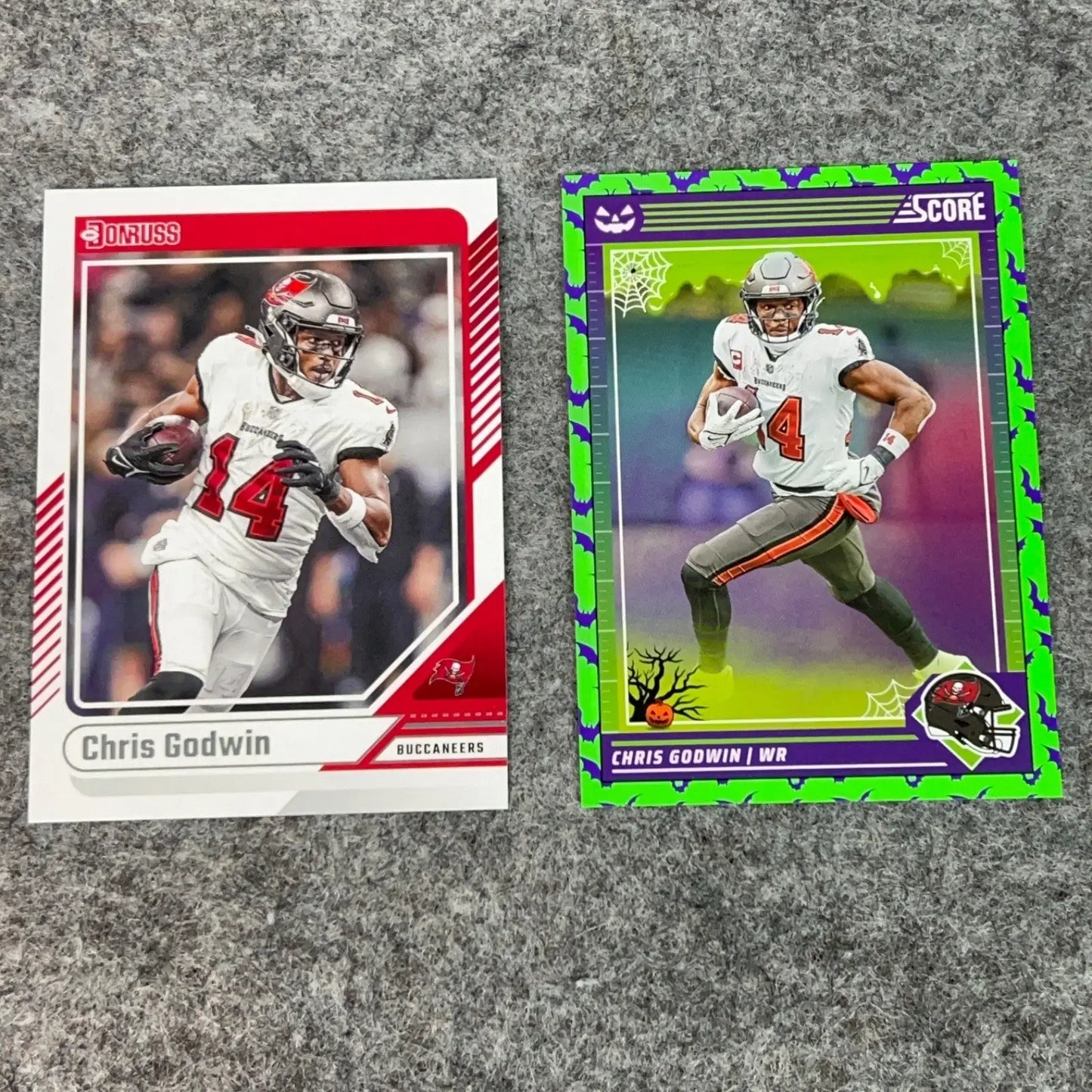 Two Chris Godwin Tampa Bay Buccaneers 2024 NFL football trading cards displayed