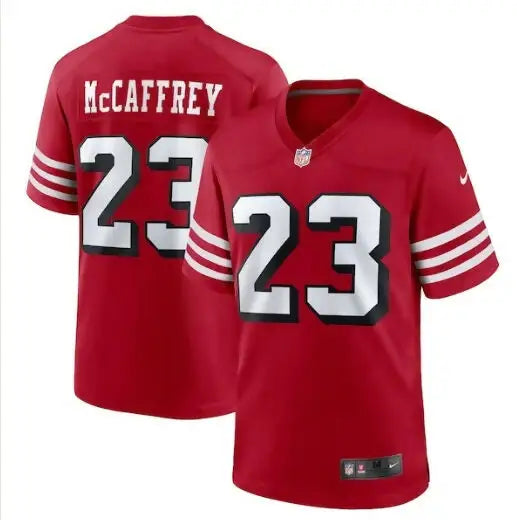 Red NFL Christian McCaffrey San Francisco 49ers jersey with white and black outlined number 23