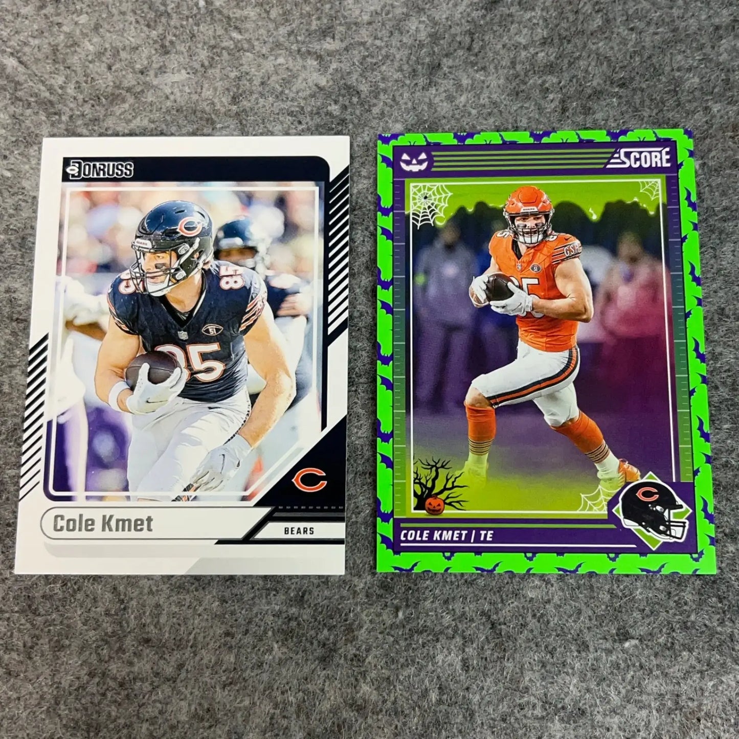 Two Cole Kmet Chicago Bears 2024 NFL football trading cards on display