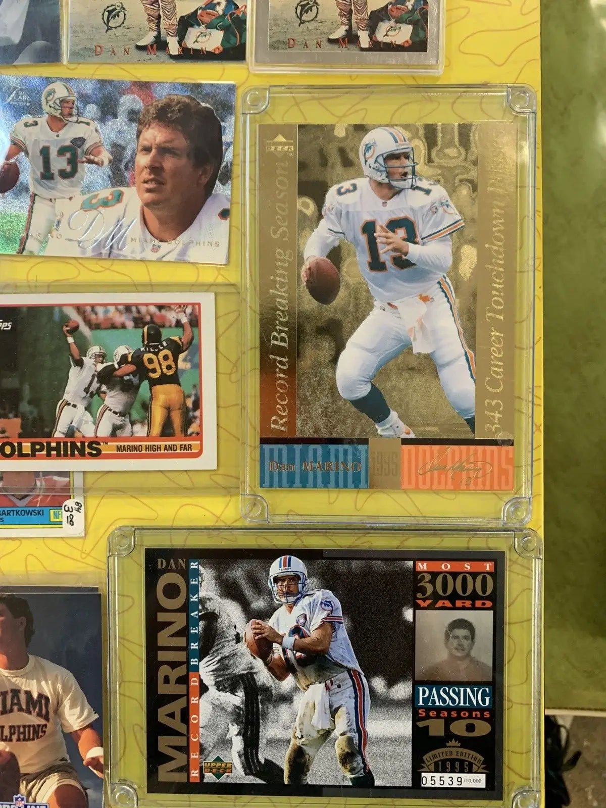 Collection of Dan Marino football cards from Miami Dolphins and Upper Deck brands