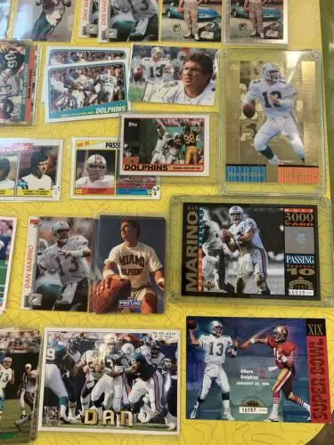 Dan Marino Miami Dolphins football card collection featuring Upper Deck and Topps cards