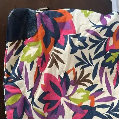 White Dana Buchman oversized floral canvas tote bag with colorful floral pattern and dark blue faux leather trim