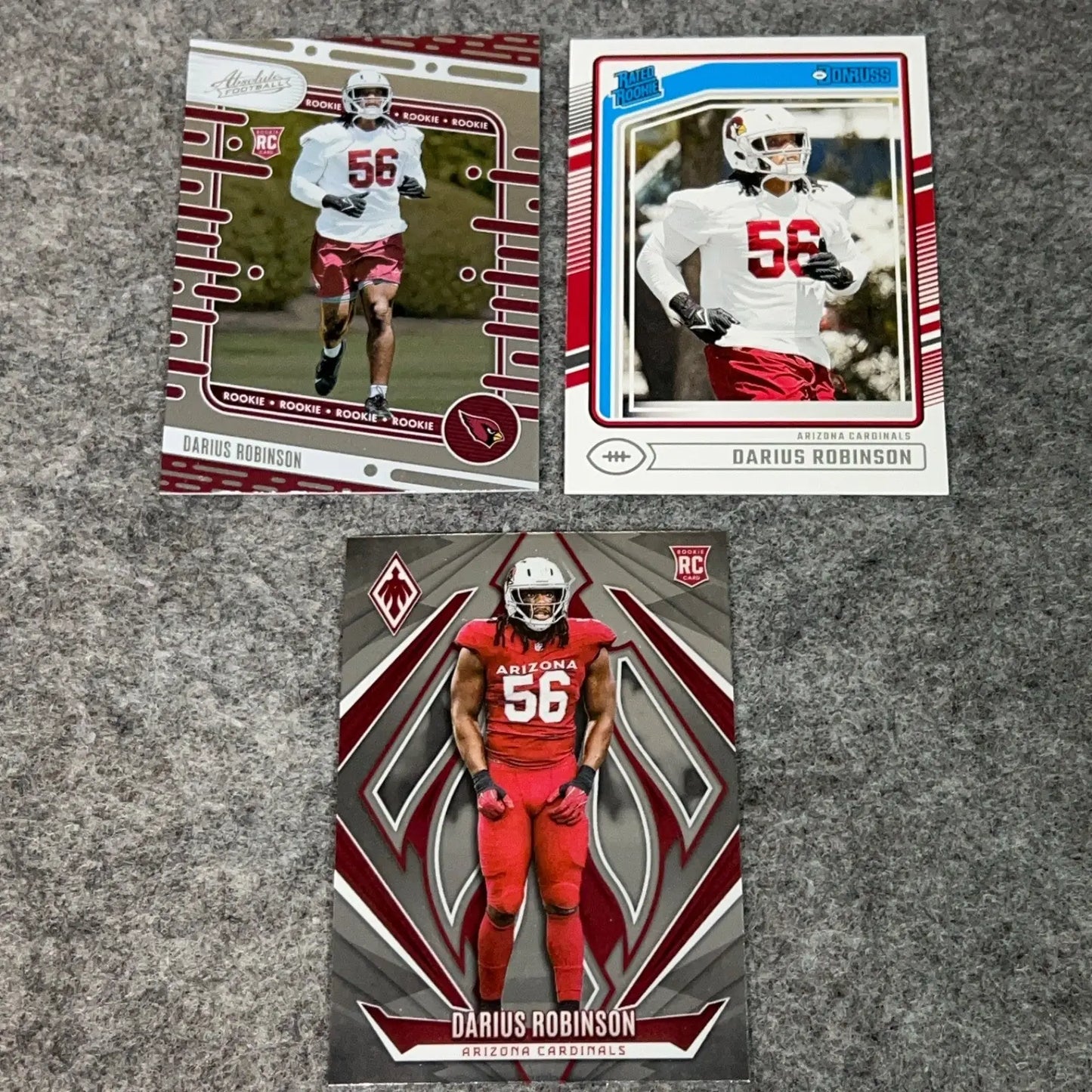 Three Darius Robinson Arizona Cardinals 2024 NFL Rookie Football Cards displayed in product