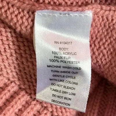 Pink knitted fleece vest with fabric care label for Derek Heart Girls Pink collection