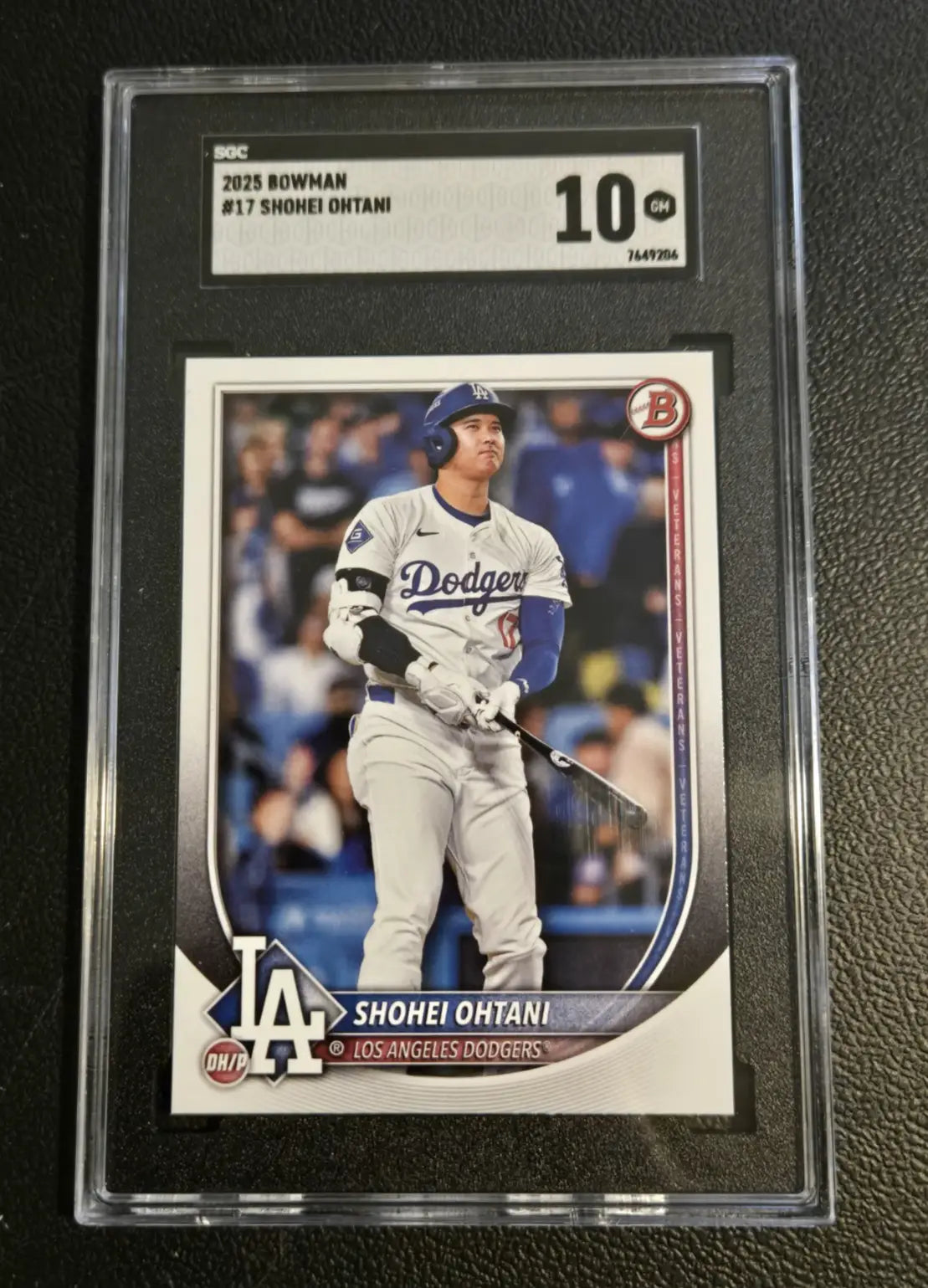 Graded Shohei Ohtani baseball card with Roki Sasaki RC SGC 9.5 and Era 9FIFTY snapback