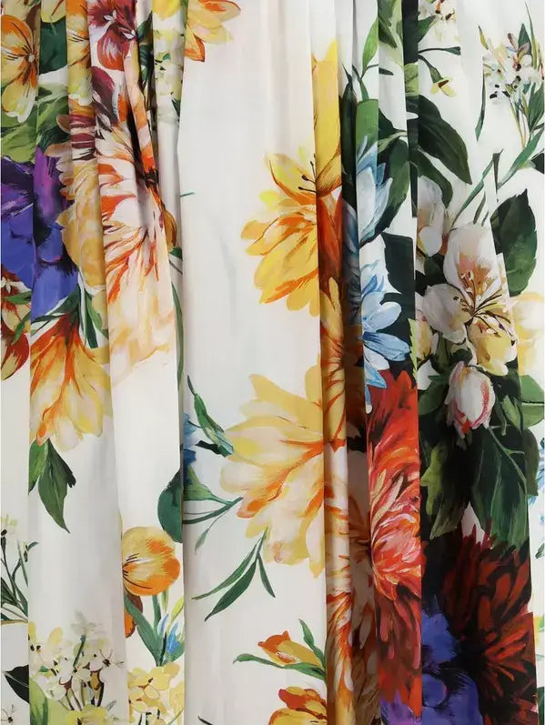 Vibrant floral print fabric with large colorful blossoms on white for Dolce & Gabbana dress