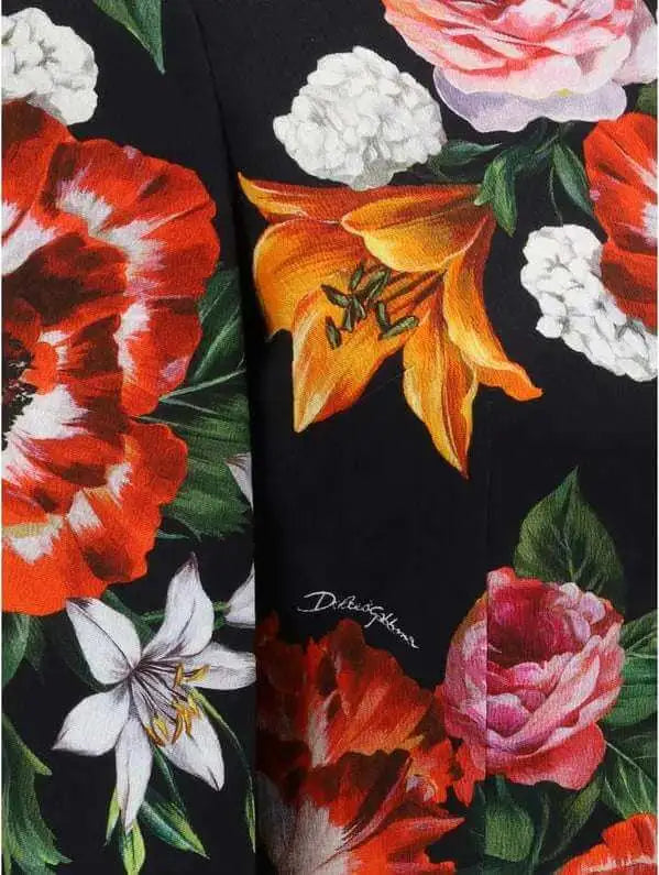 Black fabric floral midi dress with vibrant red, orange, white, and pink flowers
