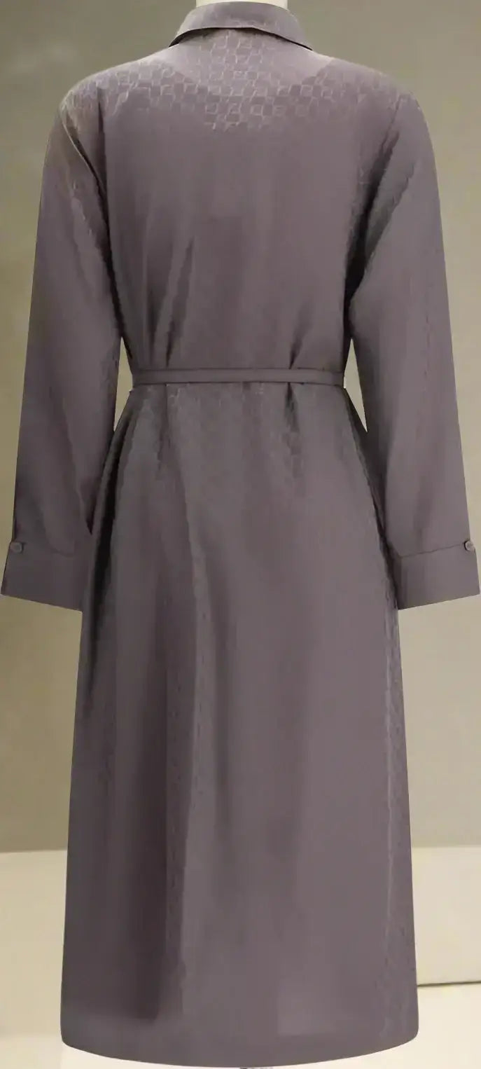 Long-sleeved dark gray trench coat with belted waist for elegant silk jacquard dress look