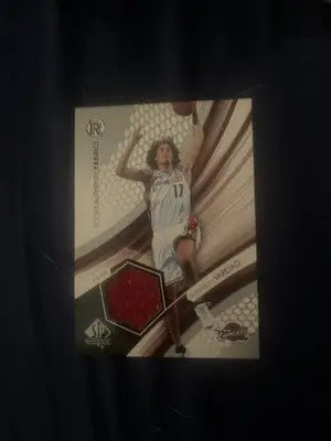 Basketball trading card featuring Anderson Varejao from 2004-05 SP Authentic Fabrics Rookies series