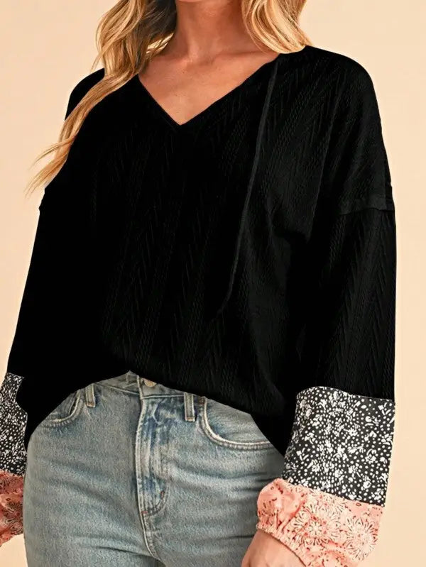 Black floral patchwork long-sleeve V-neck top with lace cuffs for stylish women