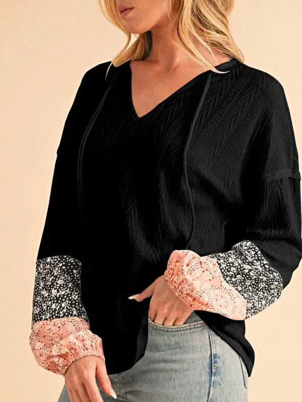 Black textured long-sleeve top with floral patchwork cuffs from Floral Patchwork Top collection