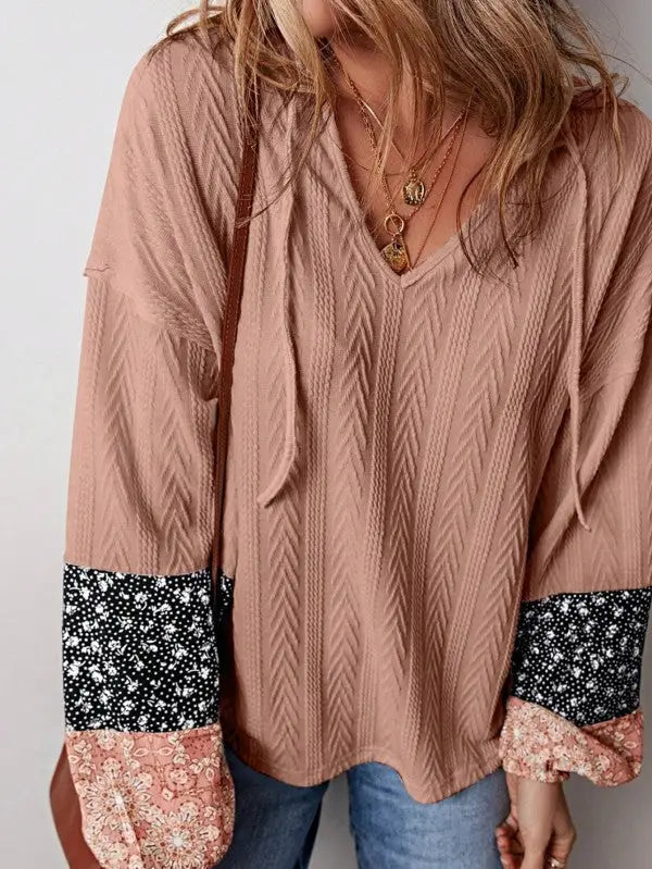 Dusty pink floral patchwork long-sleeved V-neck top with textured chevron pattern