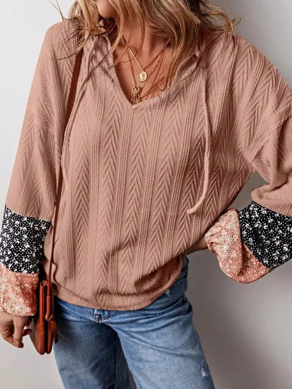 Women’s peach-colored textured floral patchwork long-sleeve hooded top with floral print cuffs