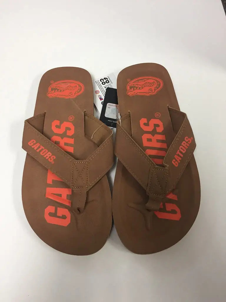 Brown flip-flops with red Gators branding, perfect for showcasing team logo display