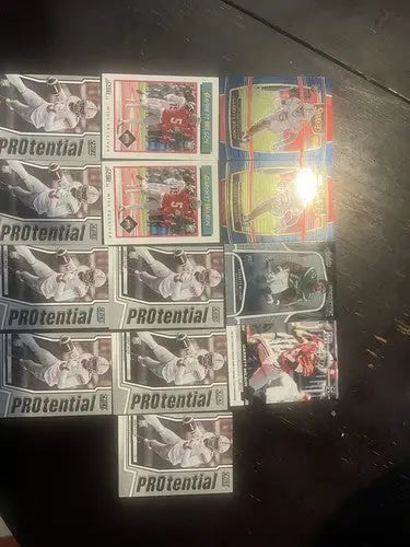 Collection of sports trading cards featuring Garrett Wilson rookie football players