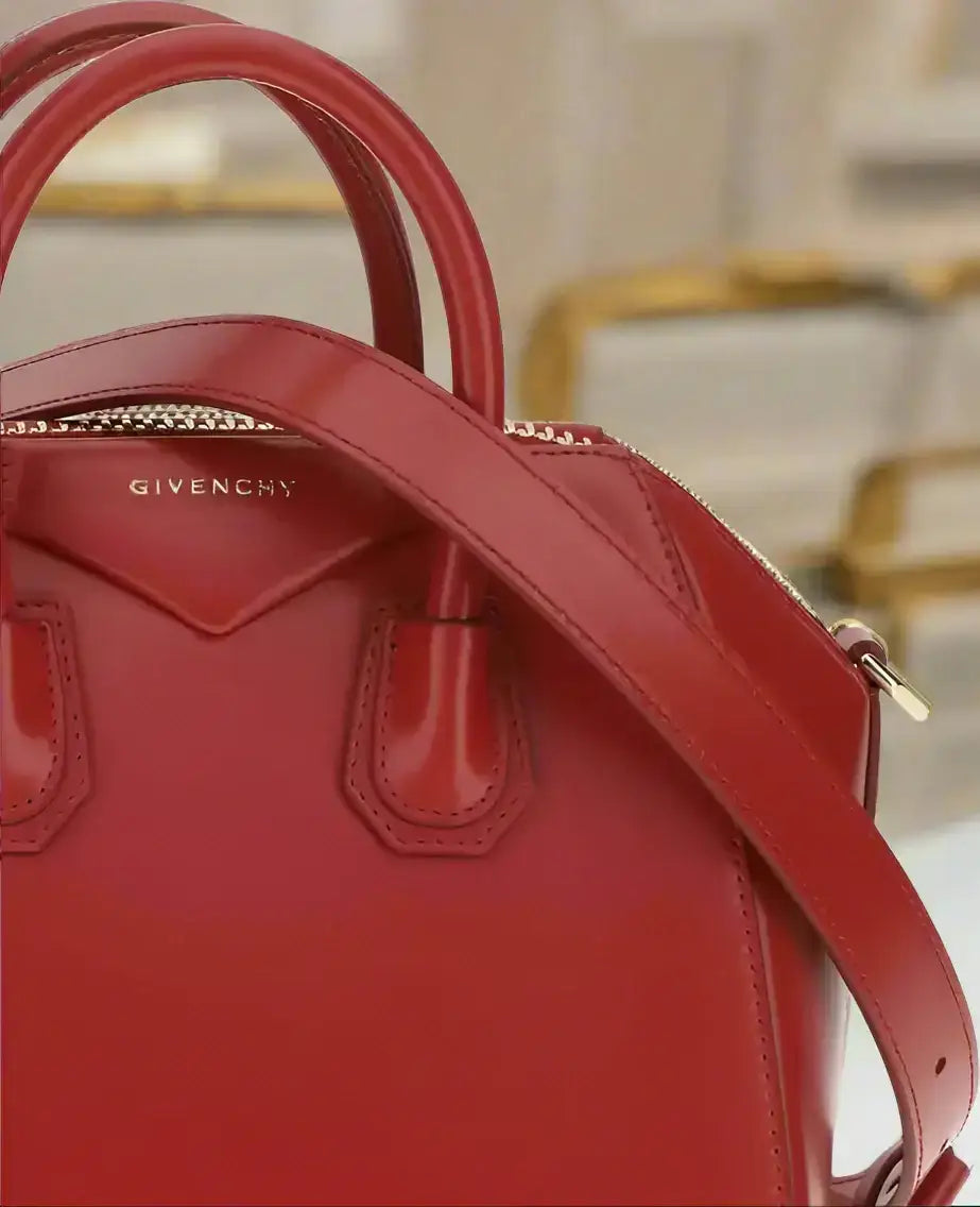 Shiny red leather GIVENCHY Antigona mini handbag with top handles and shoulder strap