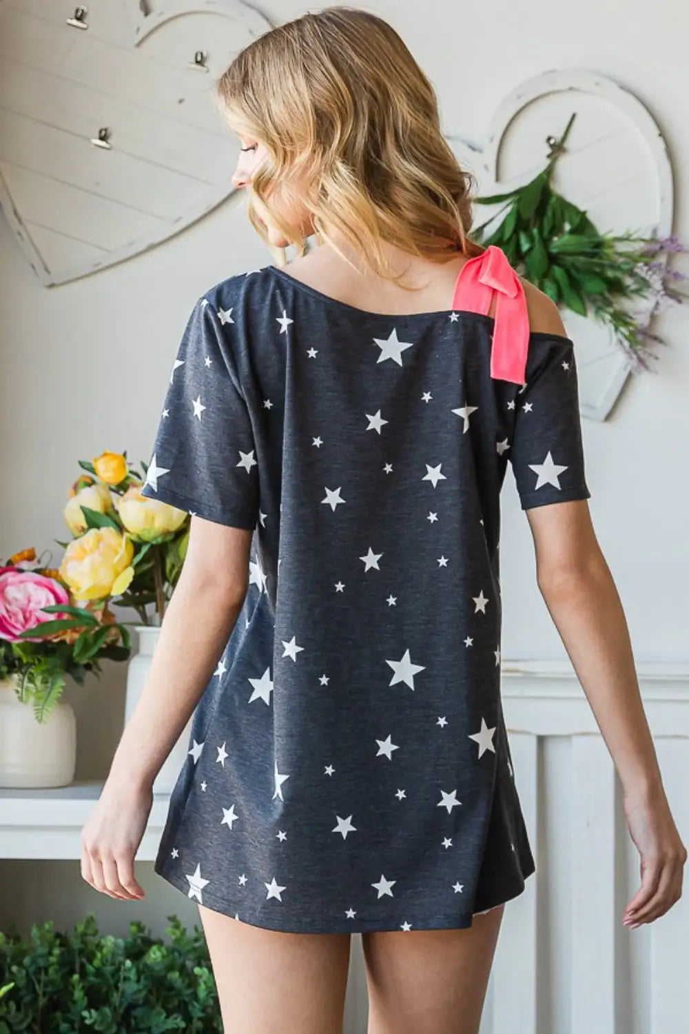Women’s dark grey star print off-shoulder short sleeve top with pink bow detail